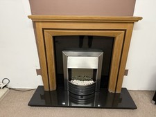 Solid Oak Surround With Black Granite Back Panel And Hearth