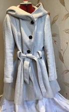 Cream bouclè, dipped hem