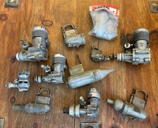 COLLECTION OF VINTAGE ENYA MODEL R/C ENGINES AND EXHAUSTS AND VECO 61 ENGINE..