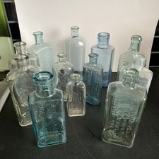 12 Apothecary Bottles Vintage Clear, Blue, Green Hues Glass Boots, Phillips Etc