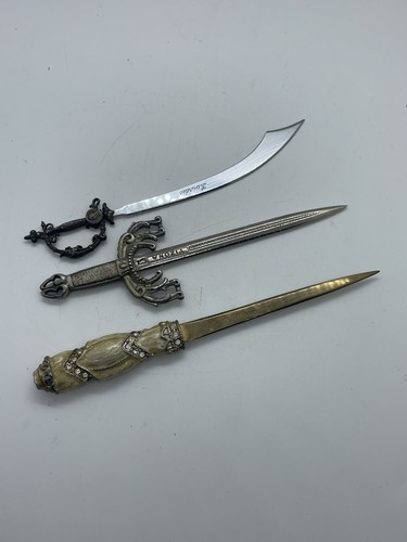 Three small letter openers - three,