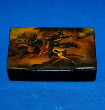 An  antique papier mache snuff