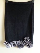 LEO GUY BLACK KNITTED SKIRT WITH SILVER FLOWER DETAIL - SIZE S/M