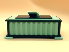 Art Deco Bakelite vanity dresser jewelry box in green and black.