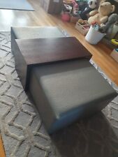 Upholstered coffee table with dark wood overlay 