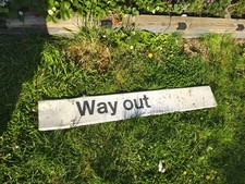 Way Out metal sign railway