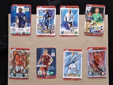 Eight hand signed cards attached to the players Trump card.