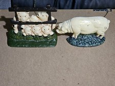 Cast iron doorstop x 2  pig