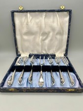 MID-CENTURY CASED SET OF