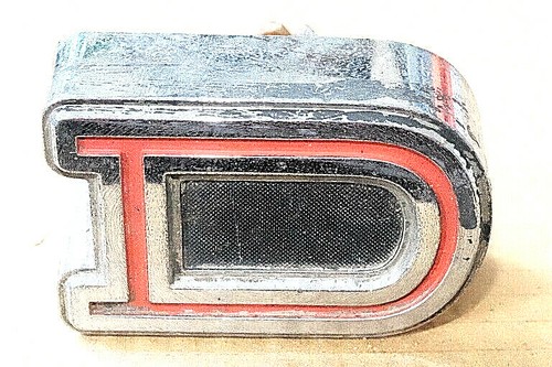 Chrome red datsun - &, "d"