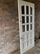 wooden front door with keys
