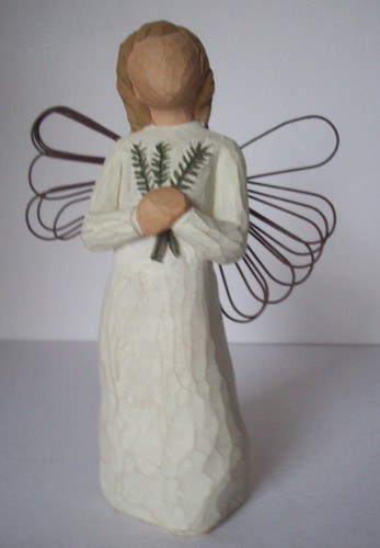 Angel holding pine - , branches