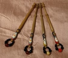 Four  hand painted Russian Doll lace bobbins with spangles