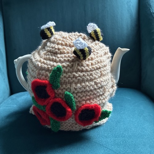 Hand knitted bee hive with - bee,