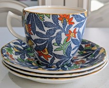 A tea cup and three saucerd Of the "Fantasy" pattern by Barker Bros Royal Tudor
