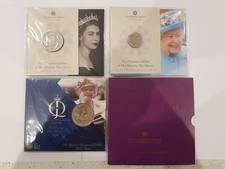 Four QEII commemorative coins