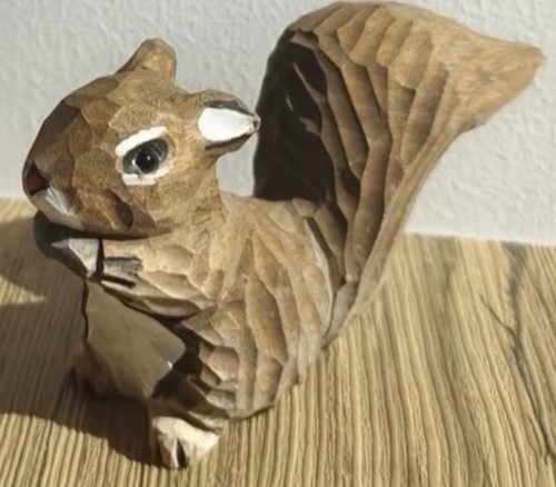 Hand carved squirrel - hand,