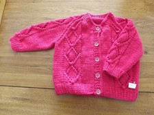 hand knitted aran baby cardigan