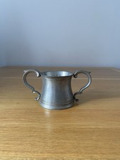 Vintage English Pewter Double Handed Jug. Measurement H 2 1/2” X 2 3/4 Wide