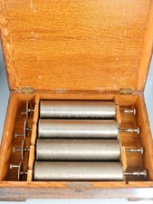 A CYLINDERS 4 MUSIC BOX clock
