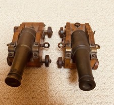 Two Miniature Brass and Oak Cannons. Made In England