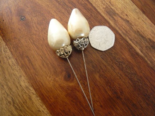 Two vintage hat pins - hat,