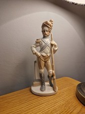 “Porcelain Dragoon Soldier Figurine — glazed, crown-‘S’ mark, repaired gun arm.