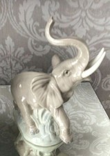 Nao Handmade Lladro Daisa Elephant With Raised Trunk.