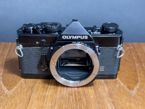 Olympus black 35mm film - om-1,
