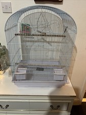 Tall white bird cage with