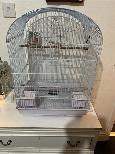 Tall white bird cage with