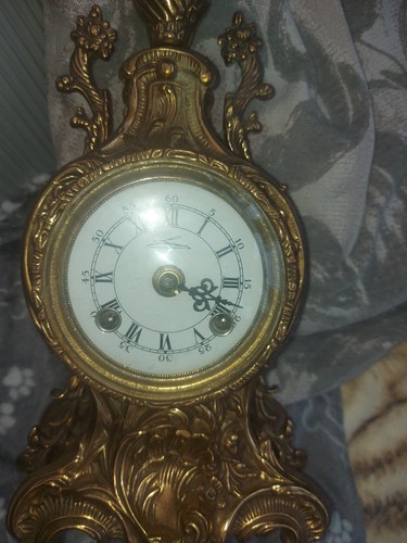 Brass mantle clock which has - mantle,