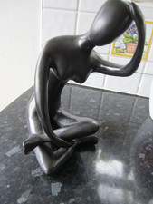 An Attractive Seated Female Figure, Probably Resin