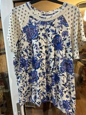 Next, striking bubble hem top