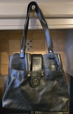 Black medium sized leather bag with double handles in excellent condition