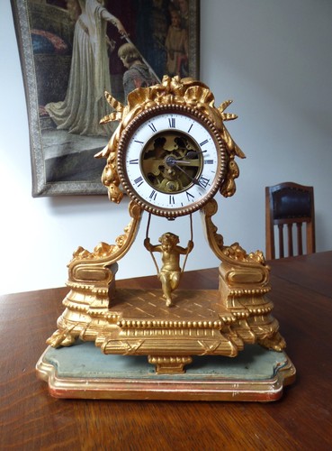 Unusual swinging cherub clock - unusual,