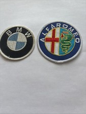 Two Car Badges. BMW And Alfa Romeo. 