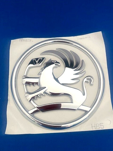Front grille badge - front,