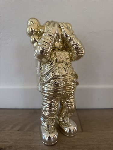Kaws holiday space gold figure - space,