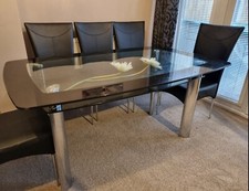 Used Harvey's 2 Tier 'Boat' Black And Clear Glass Dining Table. 4 Brown Chairs