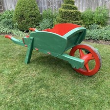 Vintage wooden garden wheelbarrow 