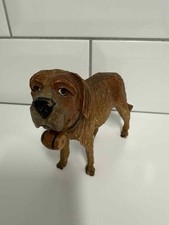 Vintage hand carved wooden St Bernard dog figurine with whiskey barrel
