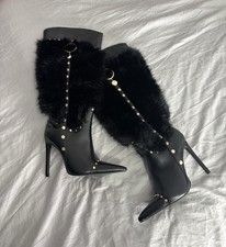 Azalea Wang stiletto heel knee