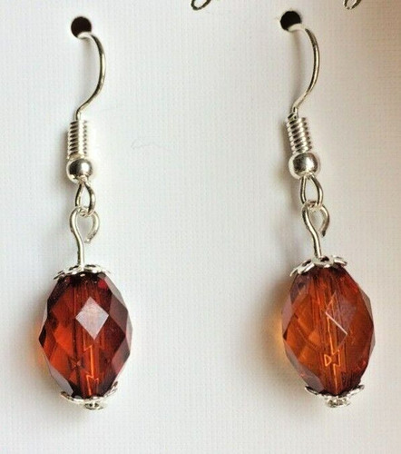 Dark amber coloured - amber,