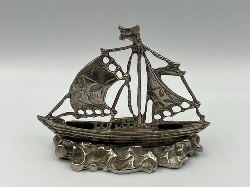 Vintage white brass ship.