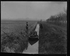 River boat workers guide small