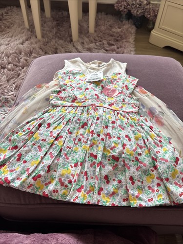 Two baby girls - dresses, one