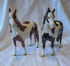 Pair of Beswick Pinto Ponies, model No. 1373, skewbald and piebald gloss (2)