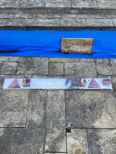 Trailer reg and lighting bar - and,