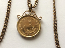 22CT GOLD 1/10th KRUGERRAND & 9,CT GOLD MOUNT & CURB CHAIN, 12.95.GRAMS,